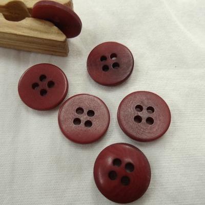 Bouton corozo teinte fraise moire 15 mm 1 