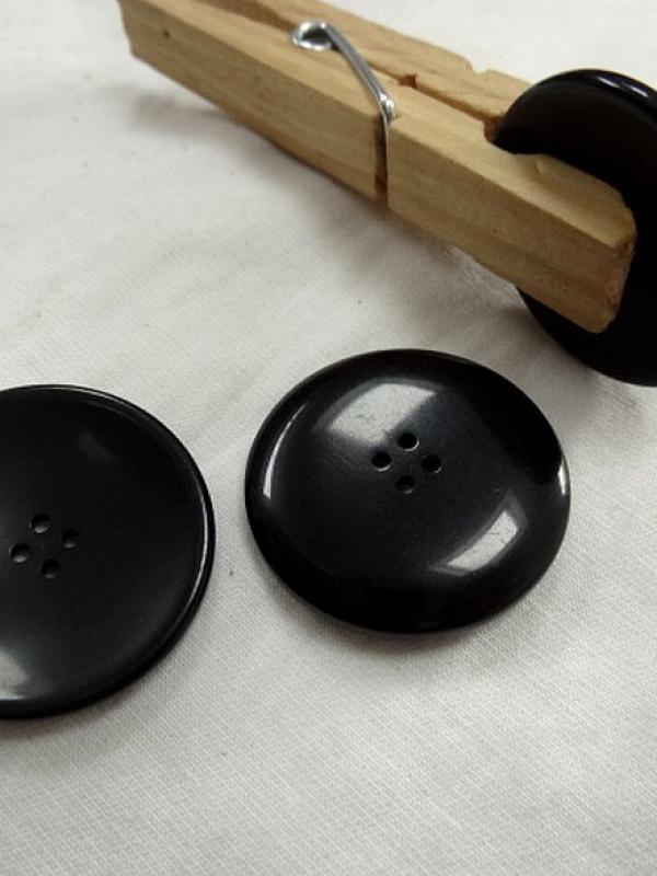 Bouton incurve noir 27 mm 1