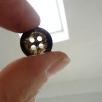Bouton noir bordure bourrelet 15 mm 