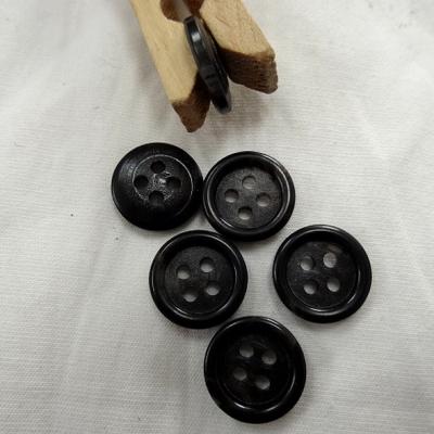 Bouton noir bordure bourrelet 15 mm 1 