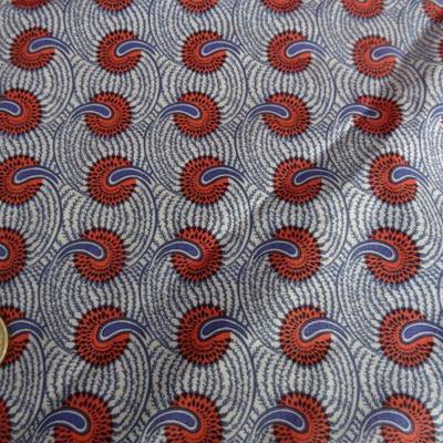 Cotonnade fond blanc motif africain rouge et bleu 02