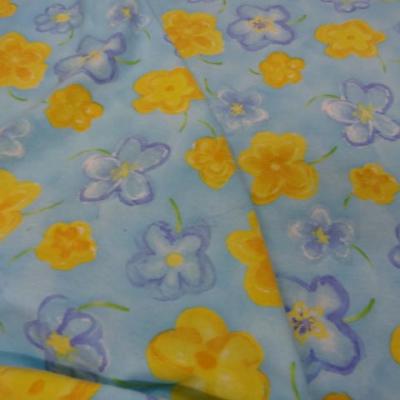 Jersey coton lycra bleu imprime fleurs