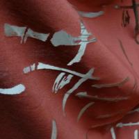 Jersey coton melange rouge tomette motif devore sur resille 1