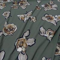 Jersey lycra vert asperge motif fleurs decoupees 1 