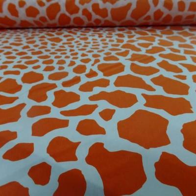 Lycra imprime taches de girafe fond blanc motif orange et jus d orange 1 