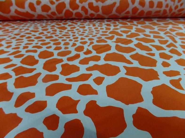 Lycra imprime taches de girafe fond blanc motif orange et jus d orange 1