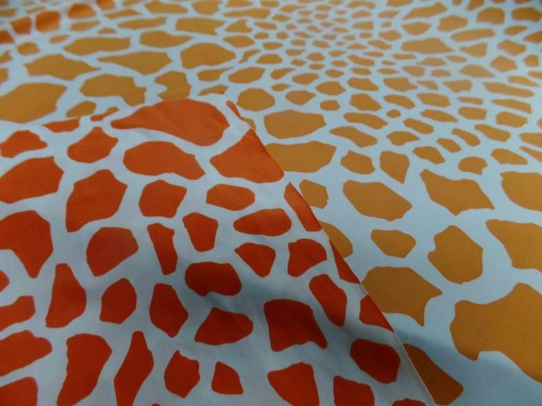 Lycra imprime taches de girafe fond blanc motif orange et jus d orange 2 