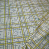 Lycra jaune et gris a carreaux paddle