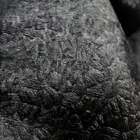 Lycra noir motif frappe satine 1