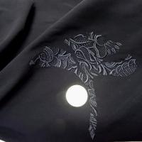 Motif fleur stylisee brodee noire sur lycra 1 