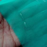 Mousseline de soie lisse bleu vert fonce 1