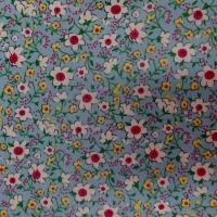 Popeline coton bleu imprime liberty fleurs blanche jaune et rouge