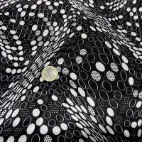 Satin noir imprime pois blanc effet d optique 