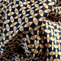 Satin polyester imprimé yeux ocres 03