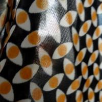 Satin polyester imprimé yeux ocres 04