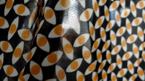 Satin polyester imprimé yeux ocres 04