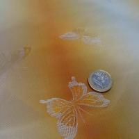 Taffetas bandes degradees orangees motif papillons faconnes 1