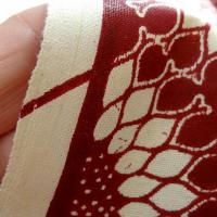 Tissu coton wax bordeaux motif fleurs soleil