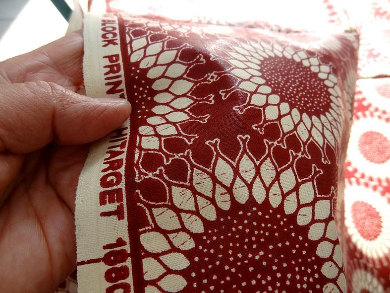 Tissu coton wax bordeaux motif fleurs soleil