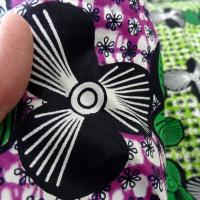 Tissu coton wax frises de fleurs vert et violet
