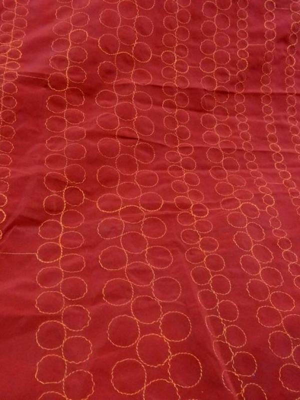 Tissu poly rouge groseille brode fil orange 1 