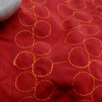 Tissu poly rouge groseille brode fil orange 3