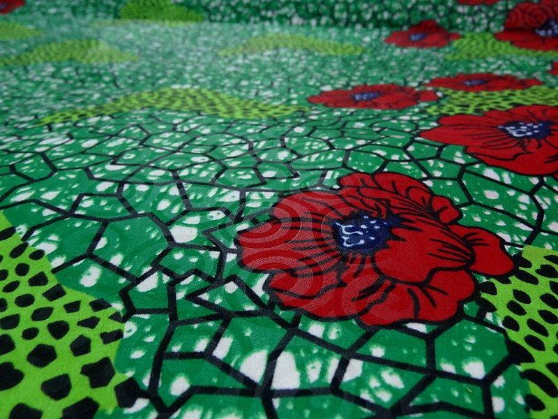 Tissu wax beaux pavots sur fond vert prairie