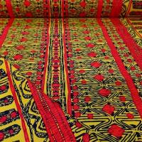 Tissu wax motif jaune rouge noir 1