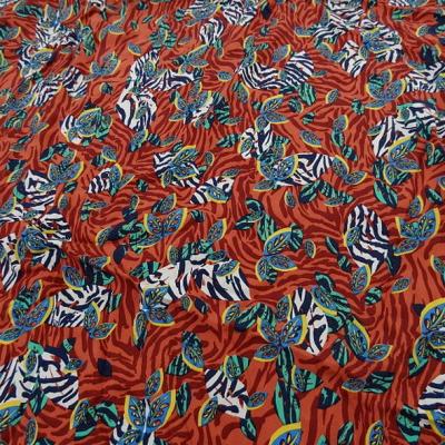 Viscose fond rouge cinabre motif fleurs zebrees 1 