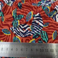 Viscose fond rouge cinabre motif fleurs zebrees 2